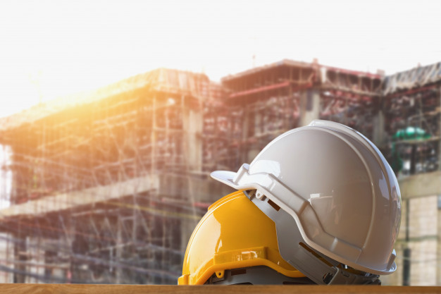 yellow-and-white-helmet-safety-in-construction-site_34152-6